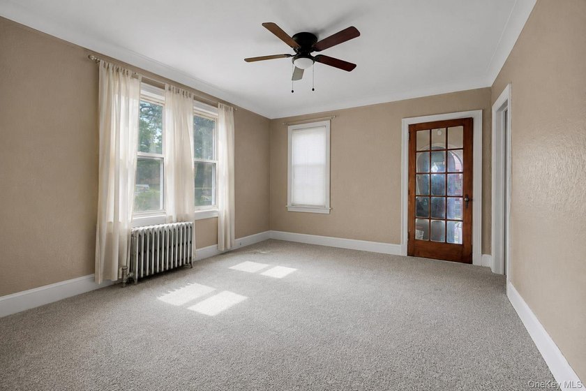 Welcome to this well-configured two-family home in the heart of - photo 2