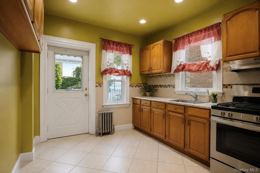 Welcome to this well-configured two-family home in the heart of - photo 4