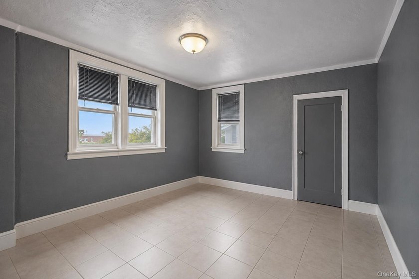 Welcome to this well-configured two-family home in the heart of - photo 10