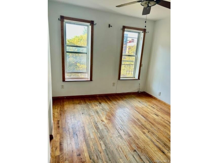 Fourth floor walk up on a tree lined block. Use of the backyard - photo 11