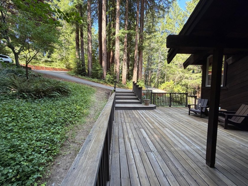 A private road and paved, circular driveway lead to this custom - photo 39