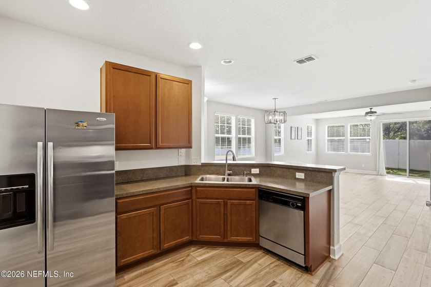 Welcome to this beautifully maintained **corner-unit townhome** - photo 15