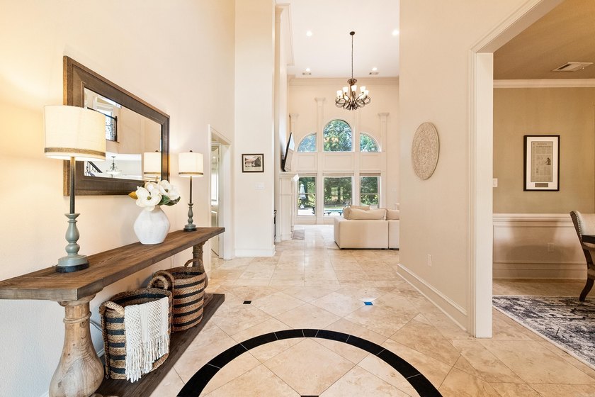 Breathtaking lake views take center stage in this exceptional - photo 3