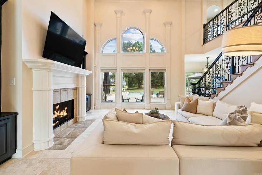 Breathtaking lake views take center stage in this exceptional - photo 4