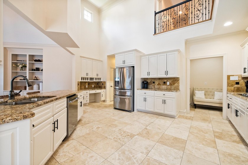 Breathtaking lake views take center stage in this exceptional - photo 8