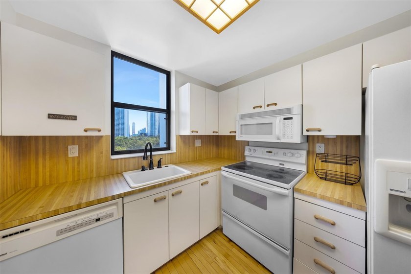 Brand-new floor-to-ceiling impact windows enhance this bright - photo 13