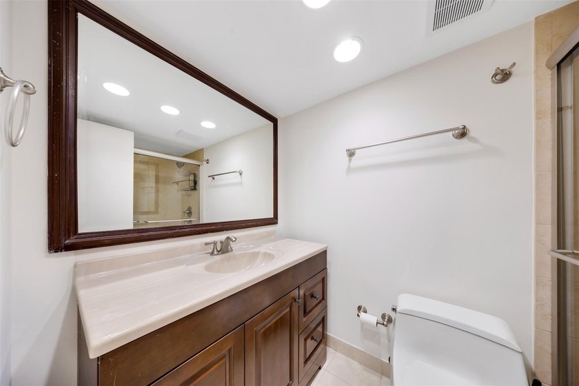 Brand-new floor-to-ceiling impact windows enhance this bright - photo 17