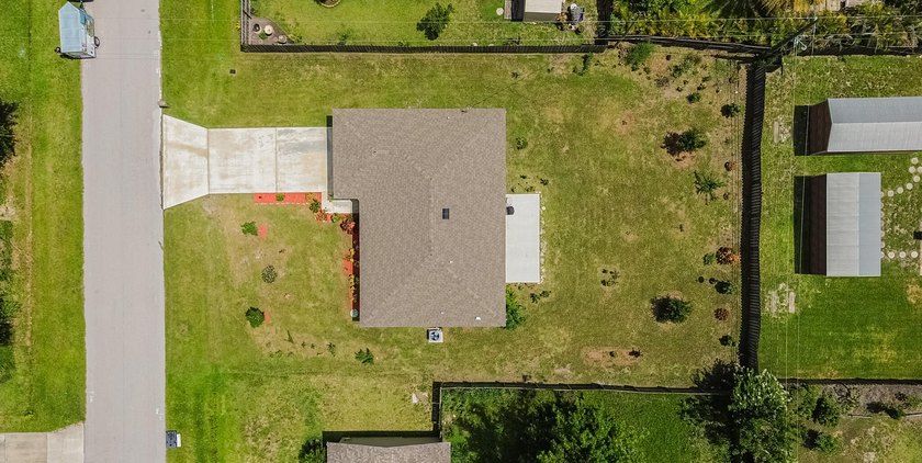 Built in 2023, this 3/2/2 CBS home perfectly combines modern - photo 19