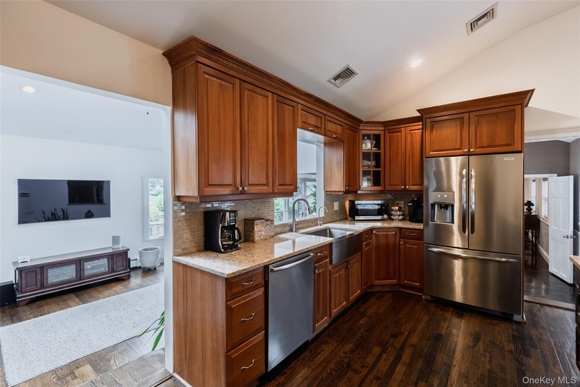 Tucked away on a lush, private three-quarter acre in the highly - photo 15