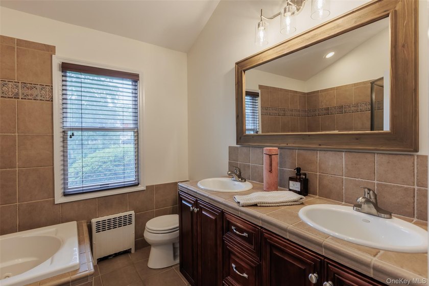 Tucked away on a lush, private three-quarter acre in the highly - photo 32