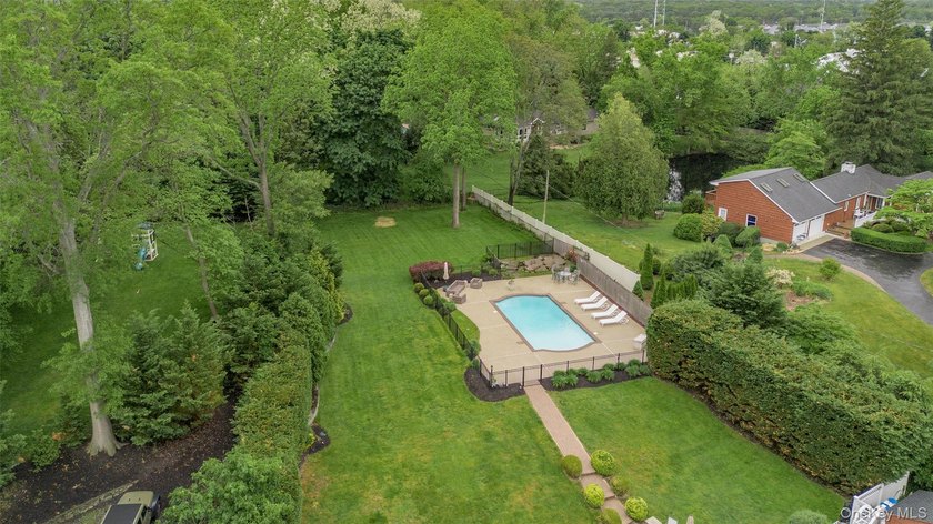 Tucked away on a lush, private three-quarter acre in the highly - photo 41