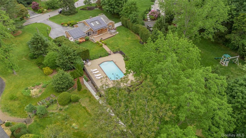 Tucked away on a lush, private three-quarter acre in the highly - photo 42