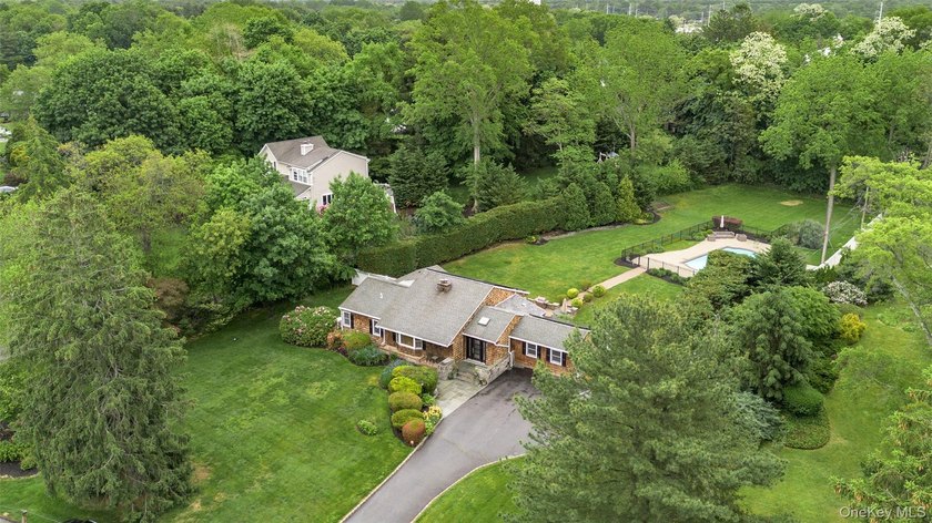 Tucked away on a lush, private three-quarter acre in the highly - photo 43