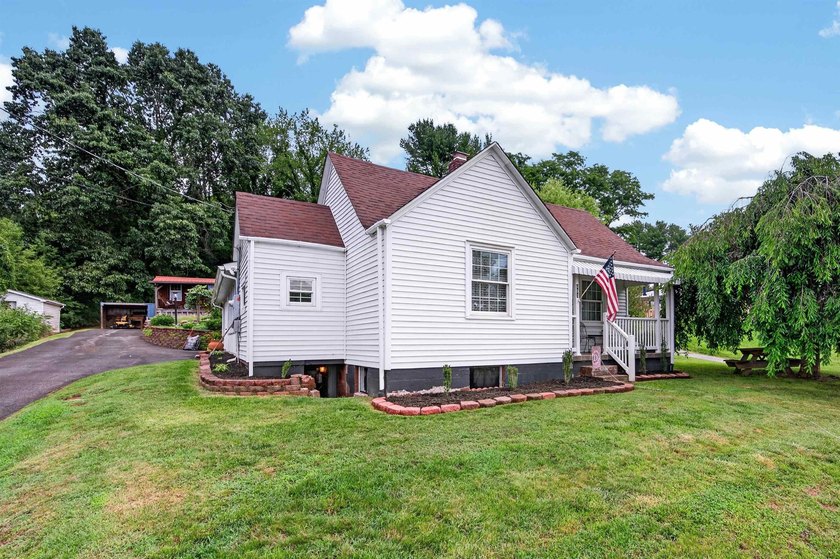 Welcome Home! This charming 1.5-story bungalow is situated on a - photo 2