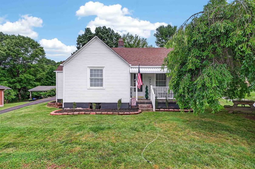 Welcome Home! This charming 1.5-story bungalow is situated on a - photo 3