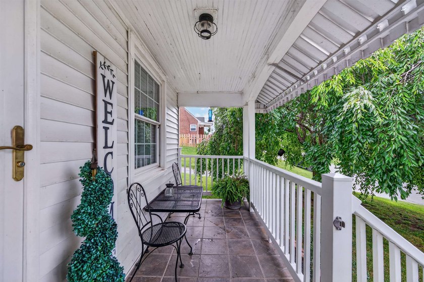 Welcome Home! This charming 1.5-story bungalow is situated on a - photo 5
