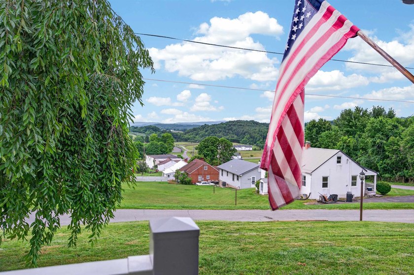 Welcome Home! This charming 1.5-story bungalow is situated on a - photo 6