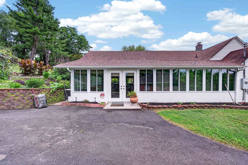 Welcome Home! This charming 1.5-story bungalow is situated on a - photo 9