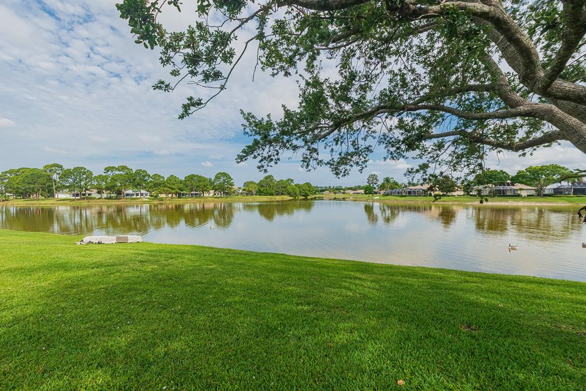 Enjoy stunning lake and pool views from this beautifully - photo 3