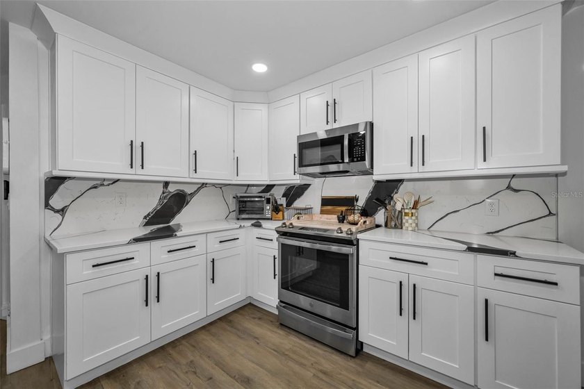 Completely renovated and move-in ready! Situated on two spacious - photo 5