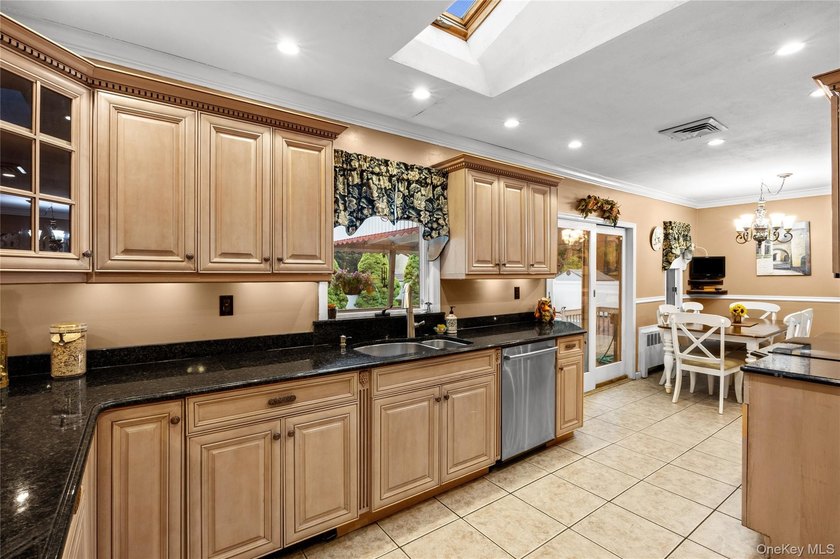 This sprawling brick ranch features a stunning open floor plan - photo 7