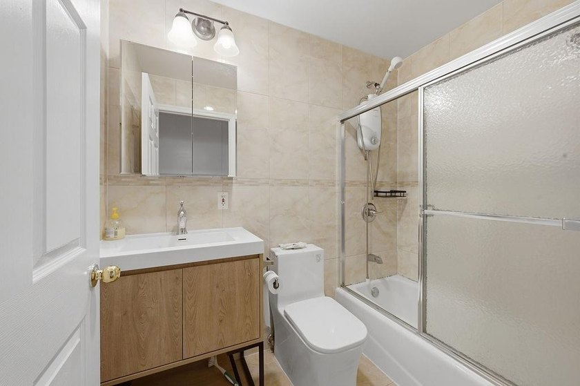 Welcome to this well-maintained semi-detached 2-family home in - photo 13