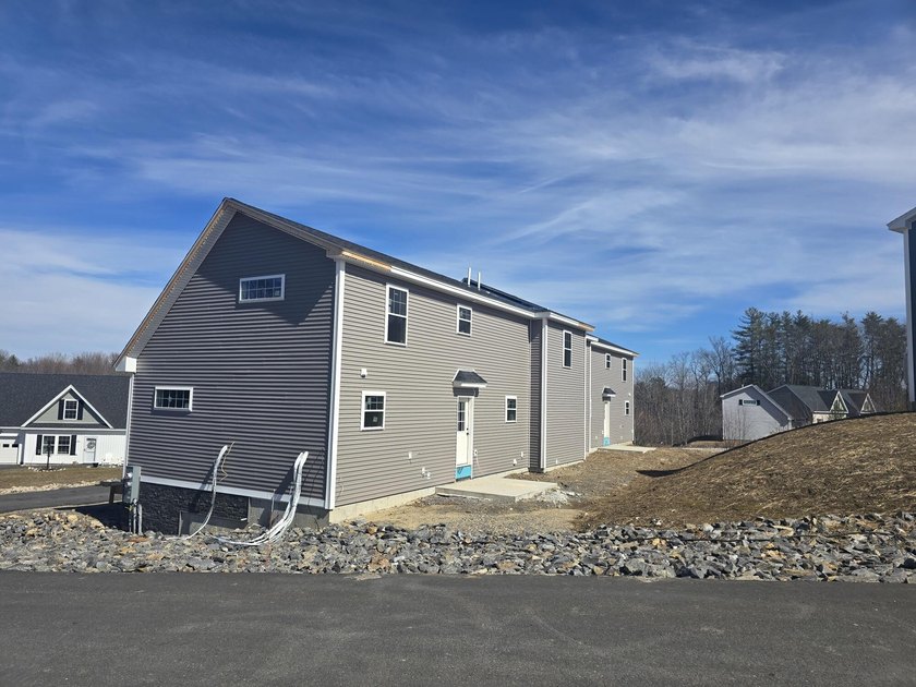 This charming two-story Cape-style duplex condo features an open - photo 3