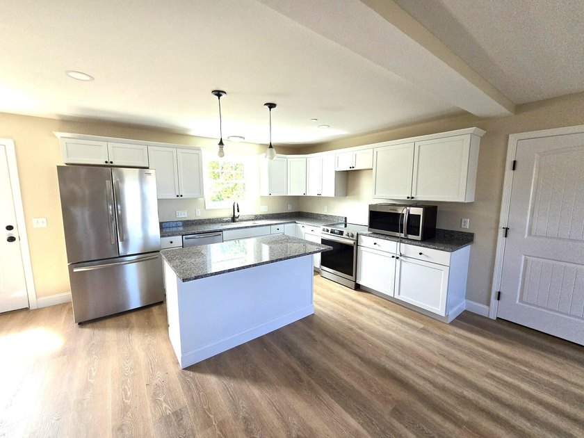 This charming two-story Cape-style duplex condo features an open - photo 10