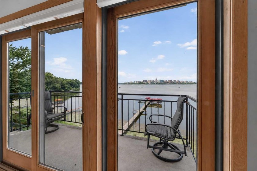 Experience breathtaking 180-degree views of Lake Monona and the - photo 2