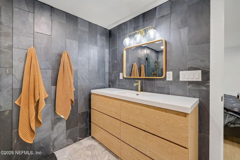 Thoughtfully renovated inside and out, this Neptune Beach home - photo 31