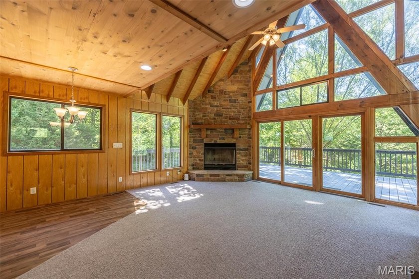 Tucked into 2.6 private acres, boasting Missouri hardwoods and - photo 3