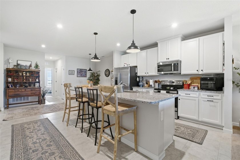 Experience low-maintenance living in this partially furnished - photo 3