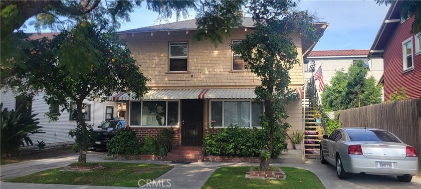 Discover the potential of this Duplex located at 411 E 8th - photo 2