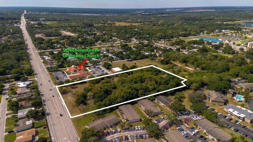 This prime 4.87-acre parcel is strategically located in a highly - photo 2