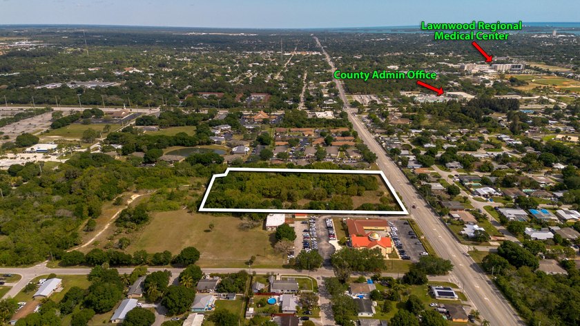 This prime 4.87-acre parcel is strategically located in a highly - photo 3