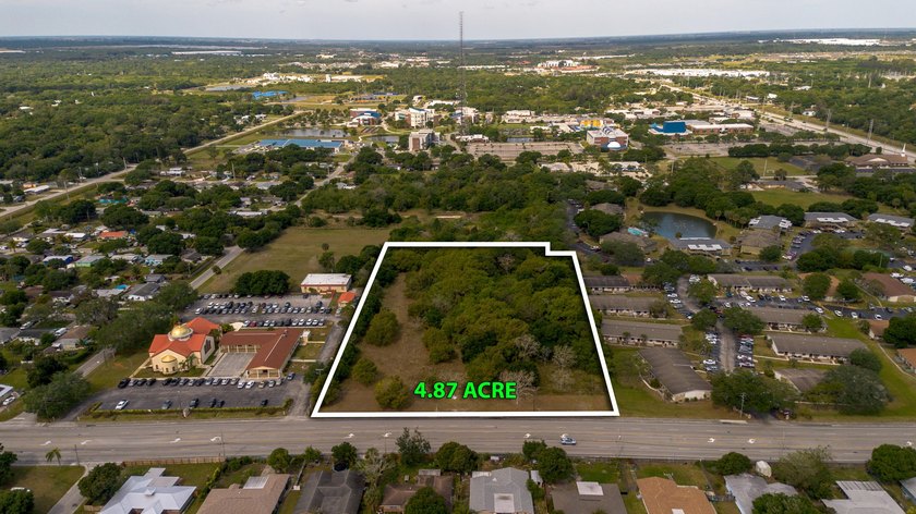 This prime 4.87-acre parcel is strategically located in a highly - photo 4
