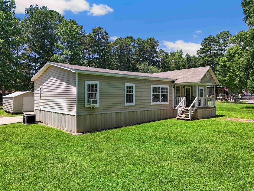 Discover the perfect blend of comfort, space, and lake living! - photo 3
