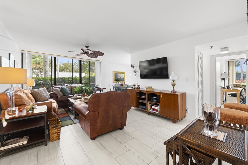 Welcome to this exceptional garden apartment, a rare find with - photo 2