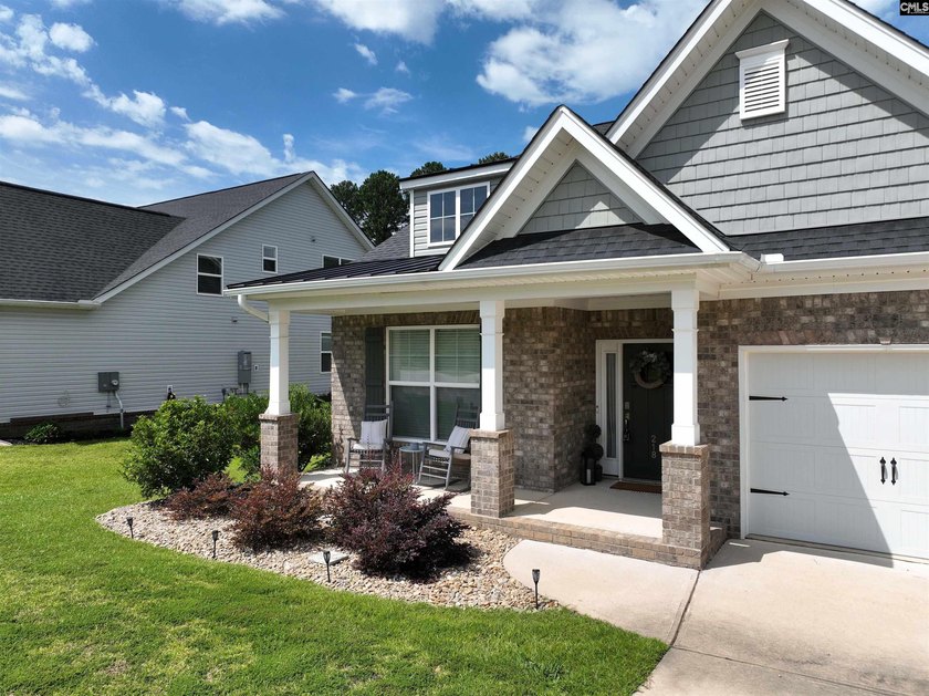 Welcome home to this beautiful all-brick ranch located in the - photo 3