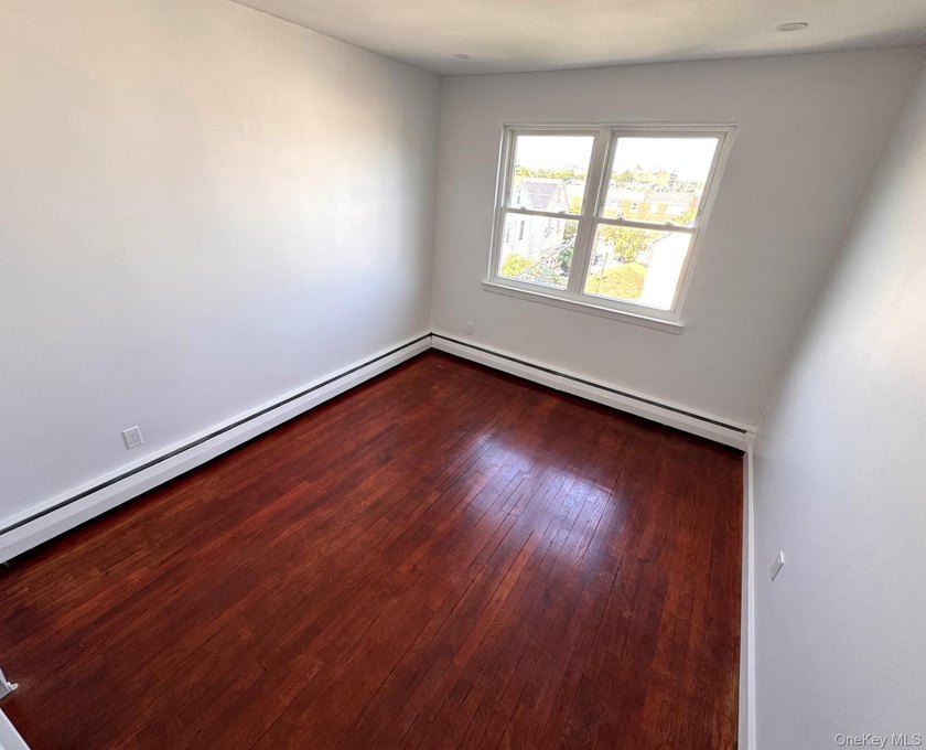 Beautifully updated two-family home in the Morris Park section - photo 11