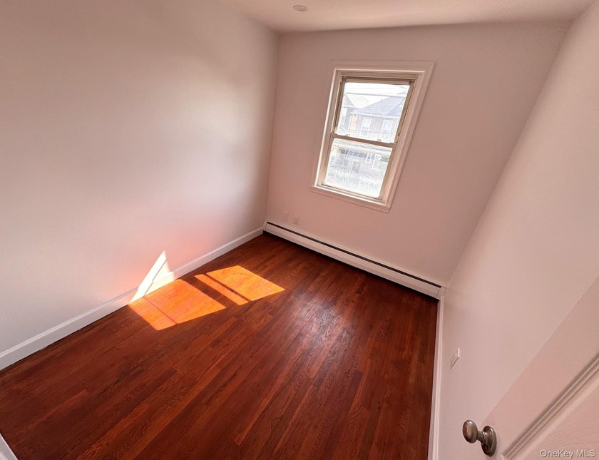 Beautifully updated two-family home in the Morris Park section - photo 15
