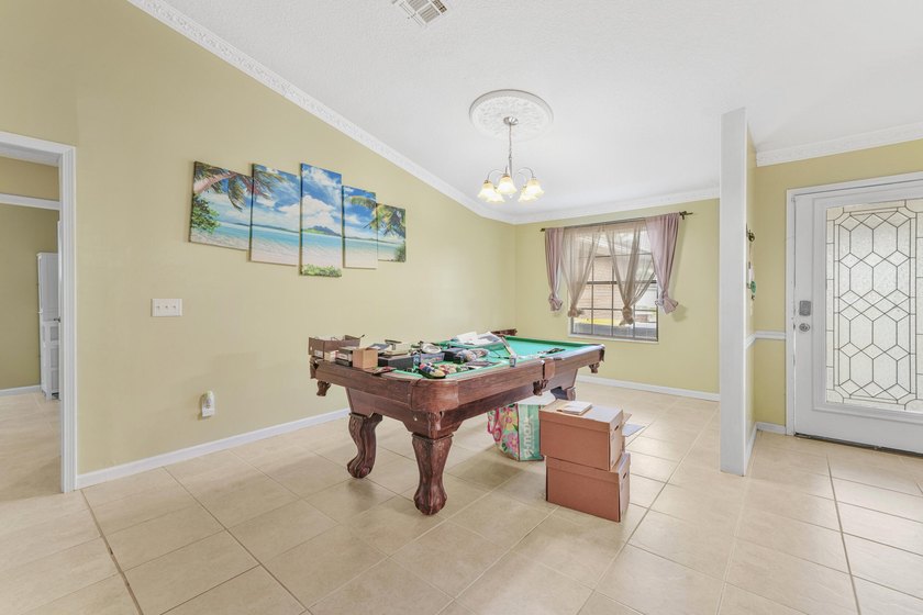 Private Florida resort-style brick home with screened pool - photo 13