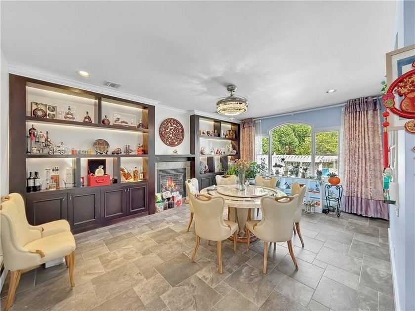 Built in 2013, this detached two-family home with brick front - photo 12
