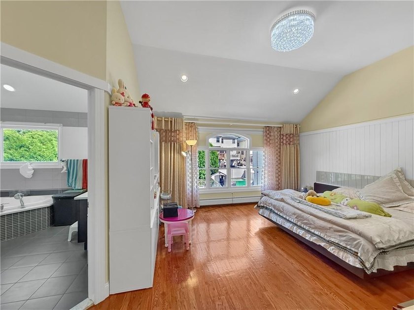 Built in 2013, this detached two-family home with brick front - photo 18