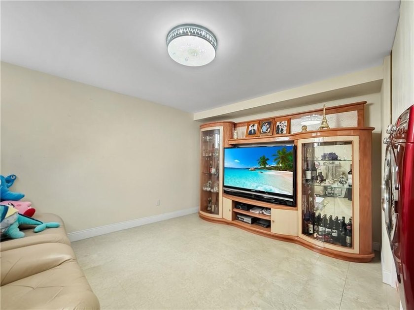 Built in 2013, this detached two-family home with brick front - photo 21