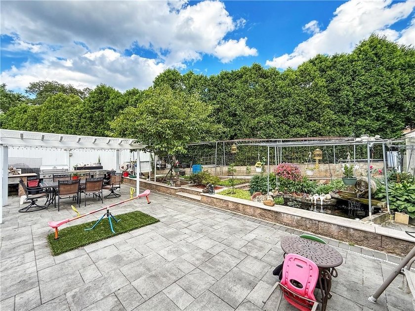 Built in 2013, this detached two-family home with brick front - photo 26