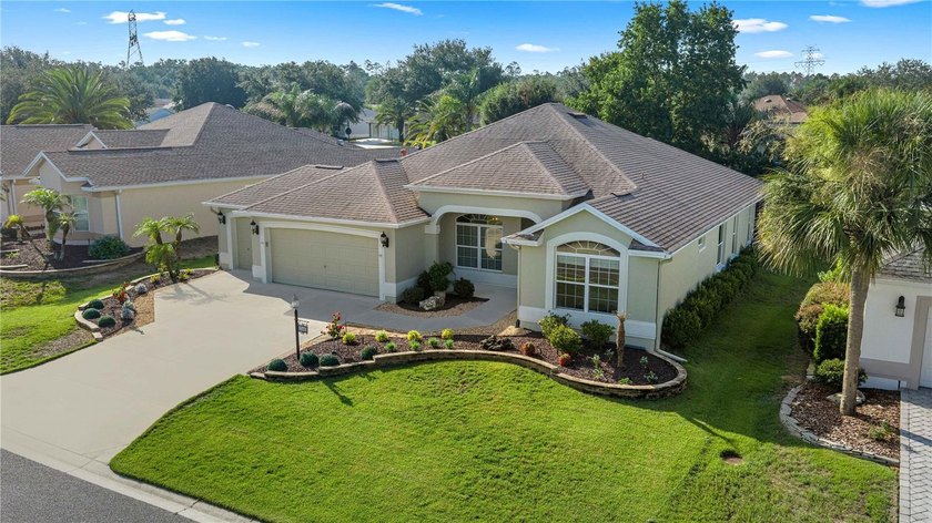 Stunning Gardenia Designer home with golf cart garage. Located - photo 3