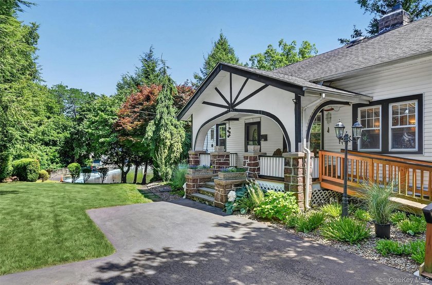 A rare waterfront gem! This beautifully reimagined 4-bedroom, 2 - photo 2