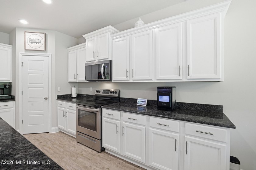 This home has it all! Featuring a spacious open floor plan, this - photo 17