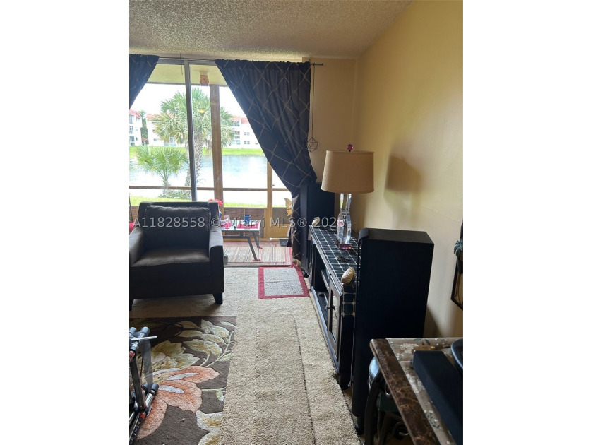 This charming first-floor condo at 2800 Sunrise Lakes Dr W - photo 4